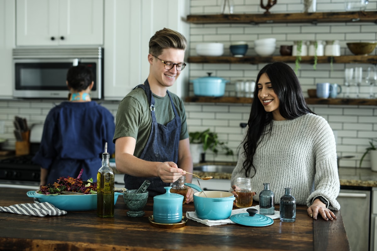 Cooks working together in a bright kitchen